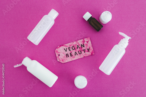 beauty products with no animal testing concept, group of moisturizers and toner lotions with Vegan Beauty message on label next to them