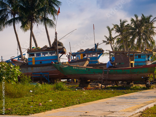HOIAN, VIETNAM, SEPTEMBER, 04 2017: Unidentified people fixing a broken boats in Hoi An, Vietnam. Hoi An is the World's Cultural heritage site, famous for mixed cultures architecture