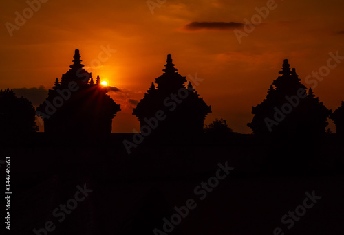 Sunset time at Plaosan temple, silhouette an ancient ruins architecture in Java island, Indonesia