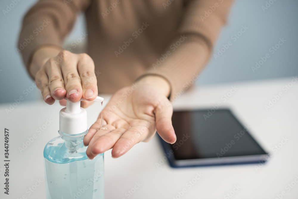 woman hands using alcohol gel for protect corona virus and bacteria, cleaning virus, healthy, covid-19, water background, quarantine concept. woman hands using alcohol gel for protect corona virus and bacteria, cleaning virus, healthy, covid-19, water background, quarantine concept.