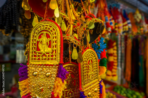 SINGAPORE, SINGAPORE - FEBRUARY 01, 2018: Close up of selective focus of colourful Indian handycrafts at a shop in Little India in Singapore. Colorful urban concept photo