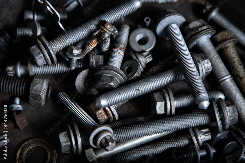 Flat Lay metal fasteners: vinitics, screws, nuts, nails, interchangeable heads, top view. Close-up Carpenter's Tool Kit Flat Lay metal fasteners: vinitics, screws, nuts, nails, interchangeable heads, top view. Close-up Carpenter's Tool Kit