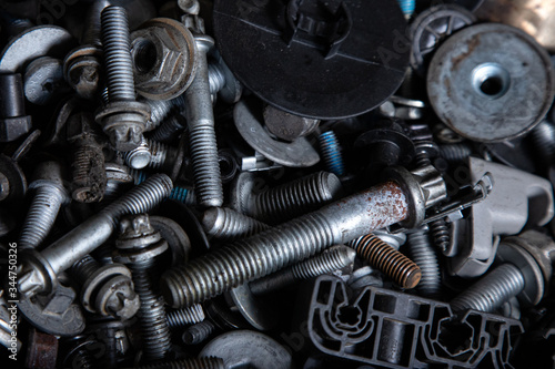 Flat Lay metal fasteners: vinitics, screws, nuts, nails, interchangeable heads, top view. Close-up Carpenter's Tool Kit © Виталий Сова