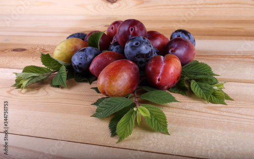 Plums on table