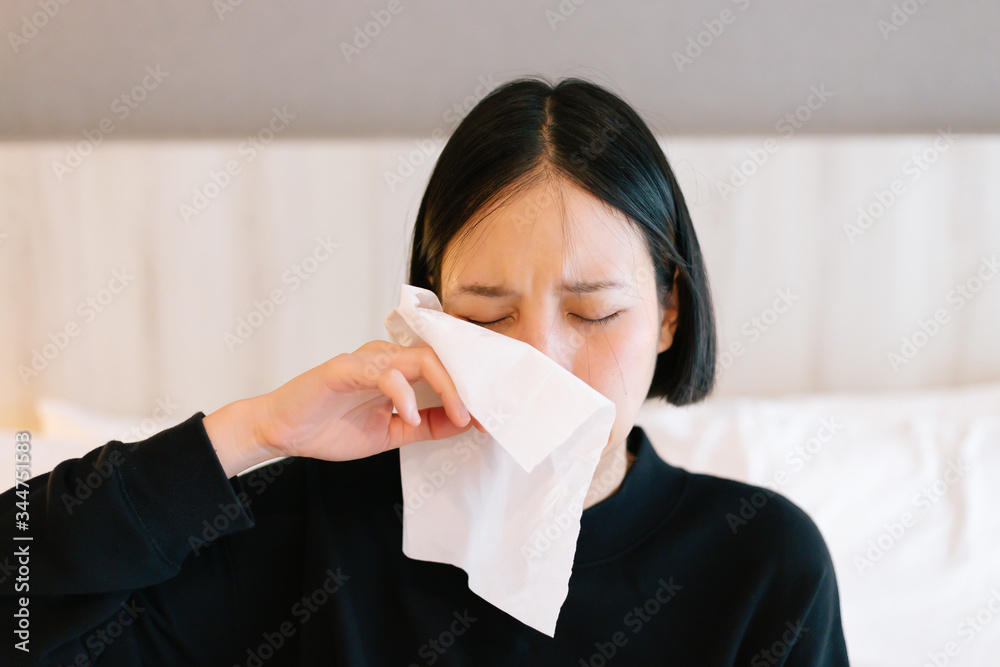 Asain female crying disappointed and sing tissue to wipe out her tear. Negative human emotion facial expression reaction attitude Asain female crying disappointed and sing tissue to wipe out her tear. Negative human emotion facial expression reaction attitude