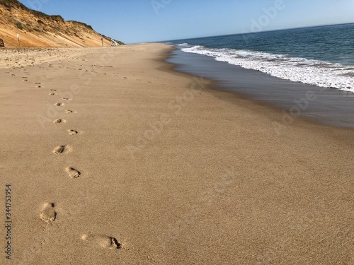 Footprints on sand photo