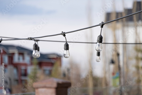 Lights strung out on wire in outside space