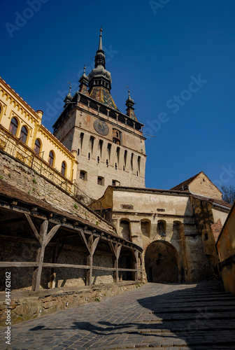 the clock tower in Sighisoara and the cobbled alley