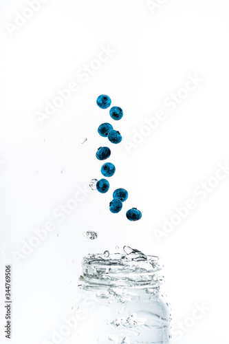 Blueberries Splashing Into Water