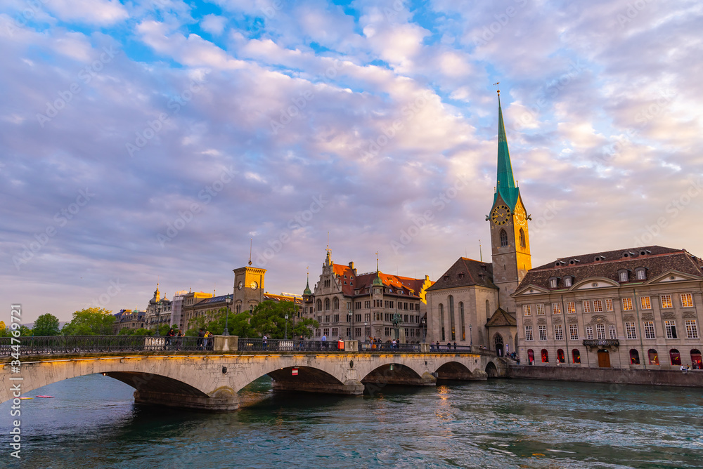 Panoramic view of Zurich city with famous Fraumunster Church and bridge.