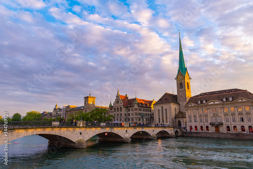 Panoramic view of Zurich city with famous Fraumunster Church and bridge.