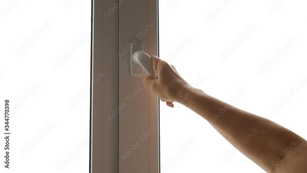 Woman opens the window. Woman opens the window.