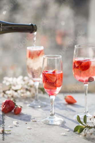 Sangria. Pink cocktail with champagne or prosecco and fresh raspberries for St. Valentine's day. © Maria