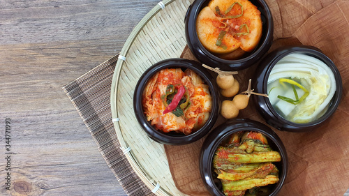Korean different kinds of Kimchi in traditional dishes in the wooden basket 