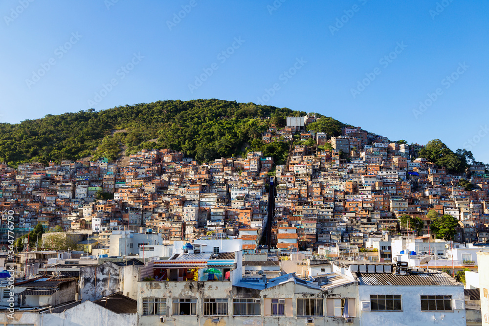 Favela of Rio de Janeiro, Brazil. Morro do cantagalo. Colorful houses in a hill. Zona Sul of Rio. Poor neighborhoods of the city. Favela of Rio de Janeiro, Brazil. Morro do cantagalo. Colorful houses in a hill. Zona Sul of Rio. Poor neighborhoods of the city.
