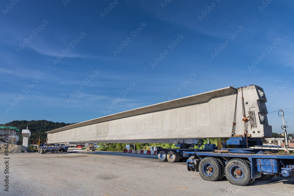 Truck transport pre-fabricated concrete beam to construct light rail transit infrastructure