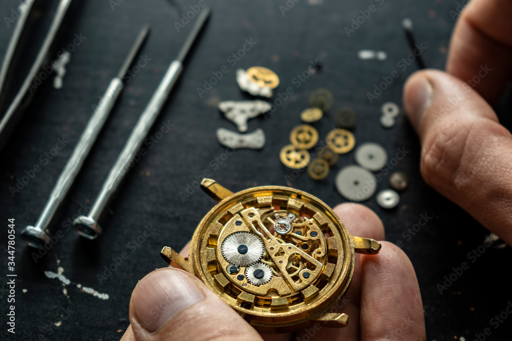 Mechanical watch repair. Watchmaker is repairing the mechanical watches