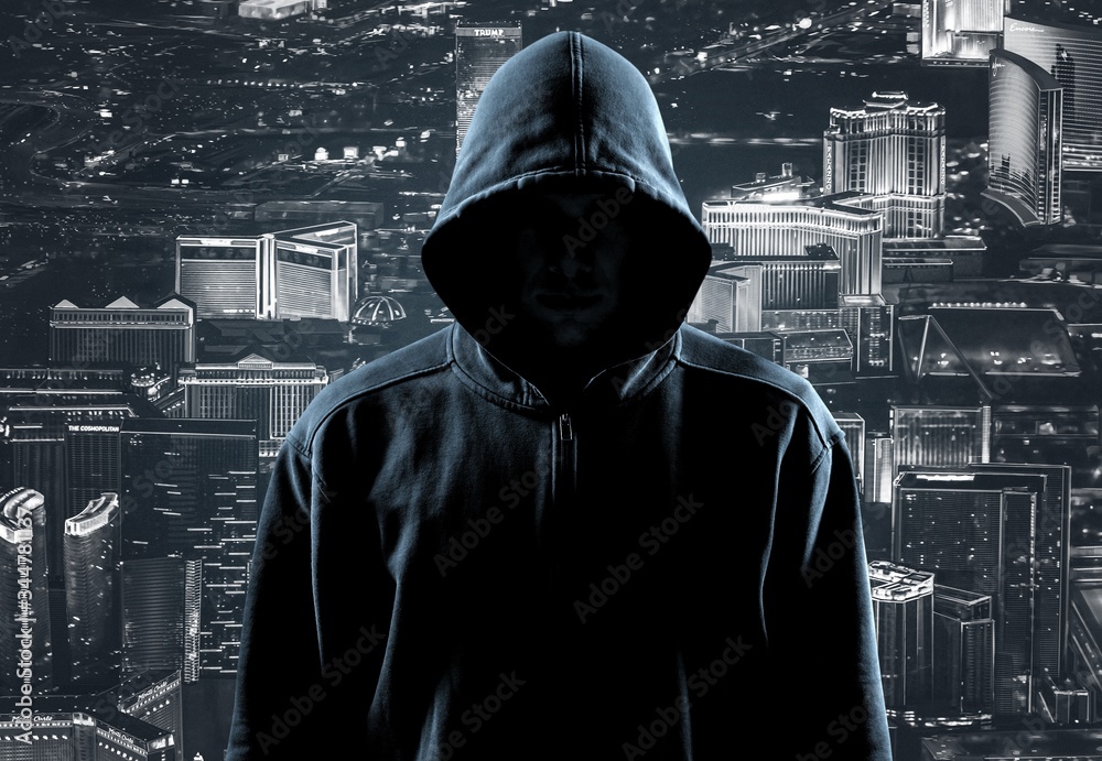 Thief in black clothes on city background Thief in black clothes on city background