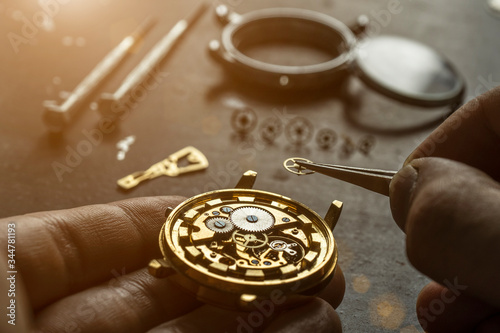 Mechanical watch repair. Watchmaker is repairing the mechanical watches