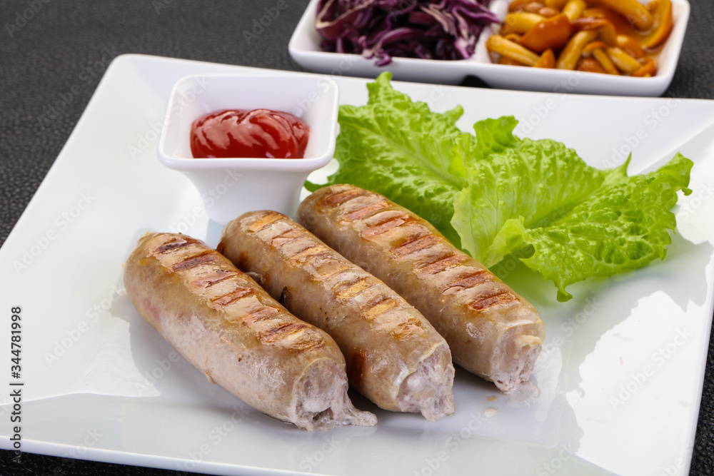 Grilled sausages served mushrooms and cabbage Grilled sausages served mushrooms and cabbage