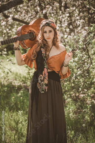 Gypsy woman with guitar at field  lifestyle  ideas for costume on Halloween