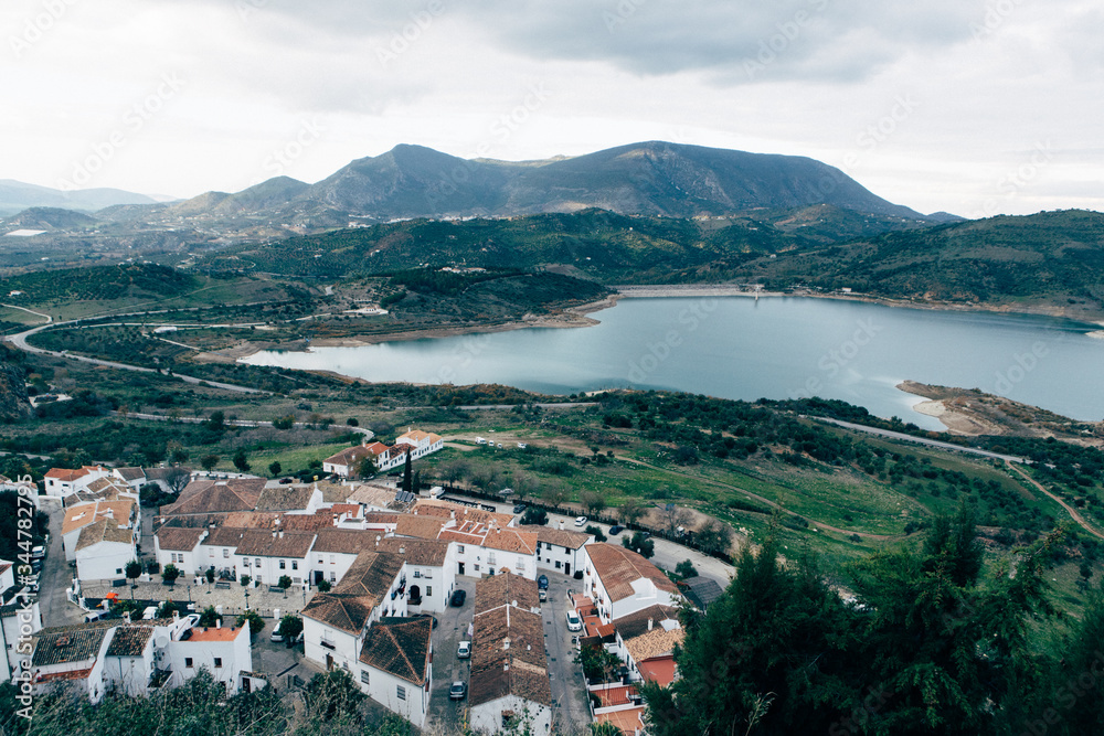 Old town in spanish andalusia mountains, view on lake from top, white houses Zahara-de-la-Sierra