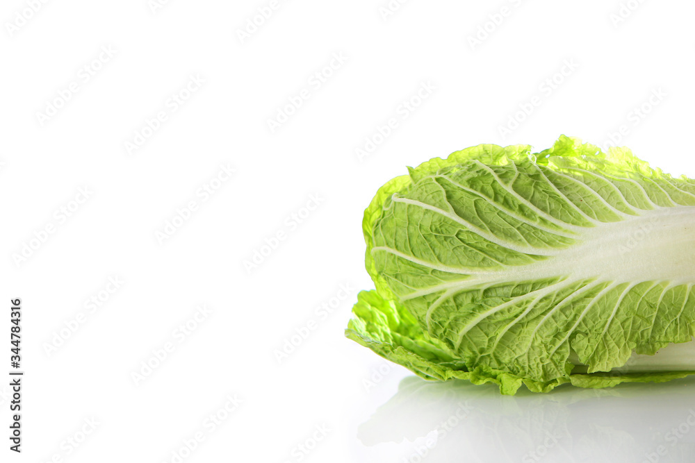 Peking or Chinese cabbage on a white background. Horizontal photo. An isolated object. Copy of the space. Peking or Chinese cabbage on a white background. Horizontal photo. An isolated object. Copy of the space.