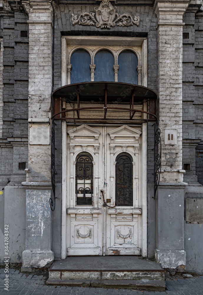 old church door. Grunge details of abandoned retro building. Architecture of Europe