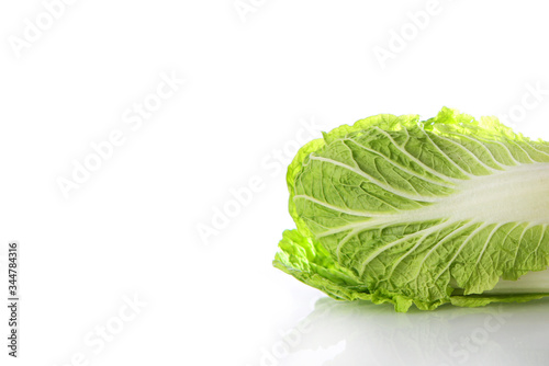 Peking or Chinese cabbage on a white background. Horizontal photo. An isolated object. Copy of the space.