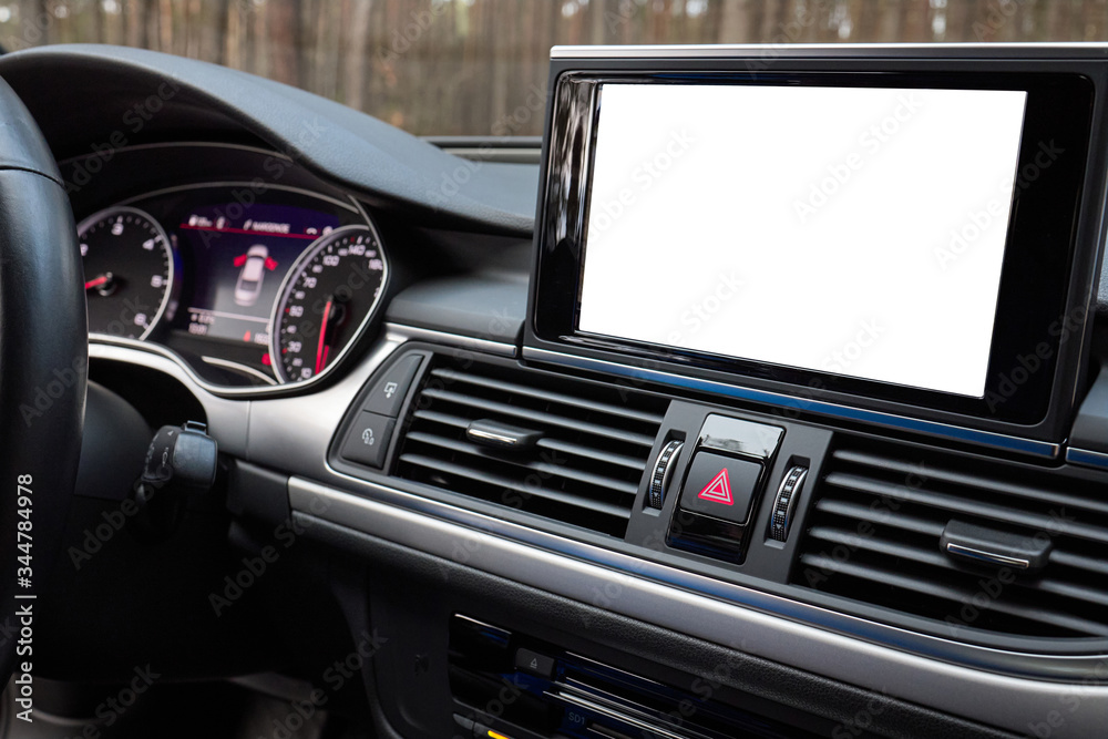 Monitor in car with isolated blank screen use for navigation maps and GPS rearview camera and parking assistant. Isolated on white with clipping path. Car display with blank screen mock up copy space.