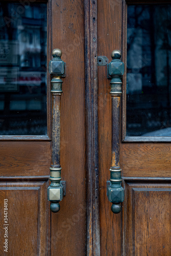 old door handleю Details of classic architecture building entrance. Doorknob closeup