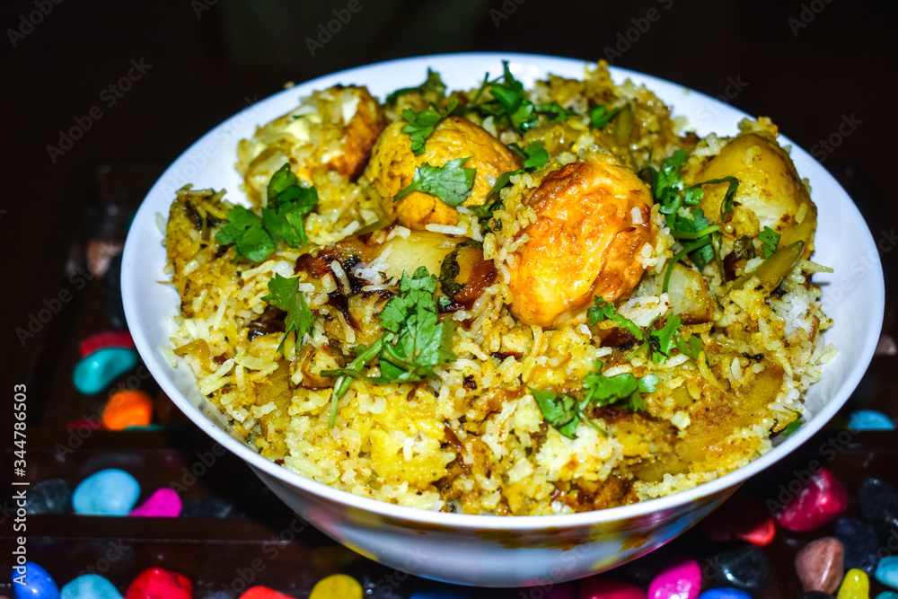 Beautiful and yummy egg biryani in a bowl image on this festival