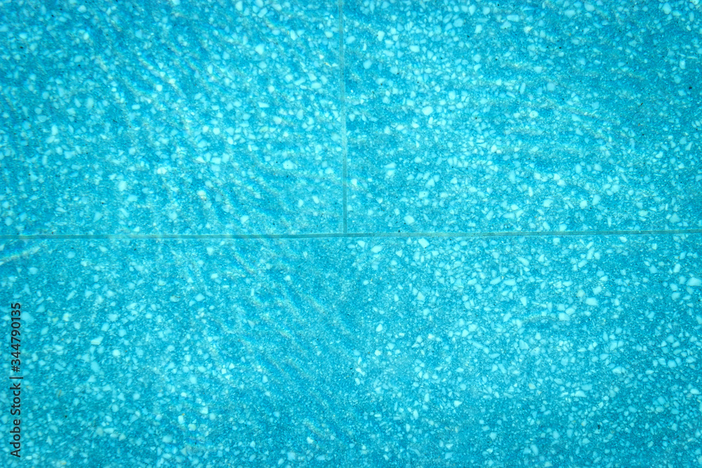Abstract top view blue swimming pool water and reflection.