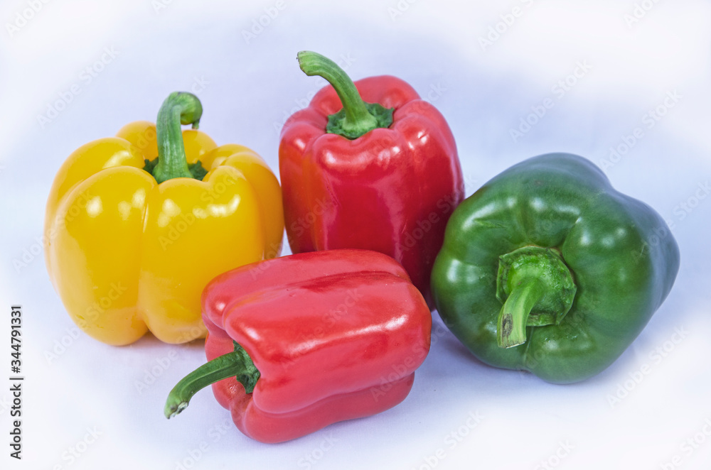 Beautiful sweet peppers on white background