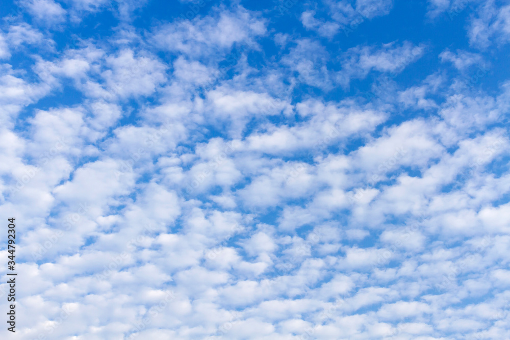 Fluffy white clouds flying on blue sky background Fluffy white clouds flying on blue sky background