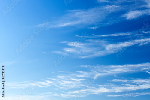 Fluffy white clouds flying on blue sky background