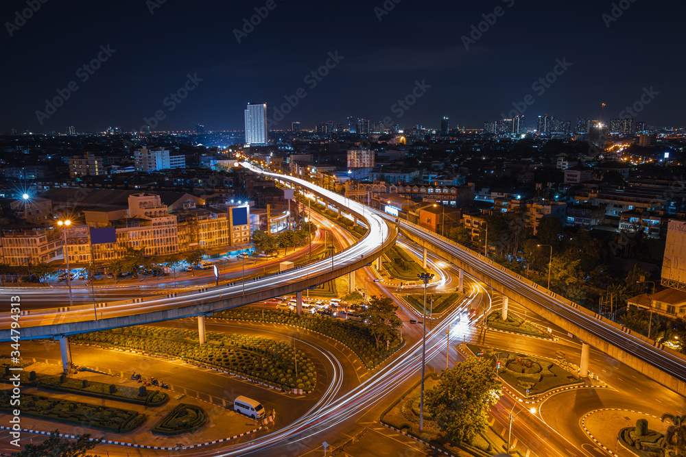 Aerial View Above of elevated road junction and traffic an important transport at night
