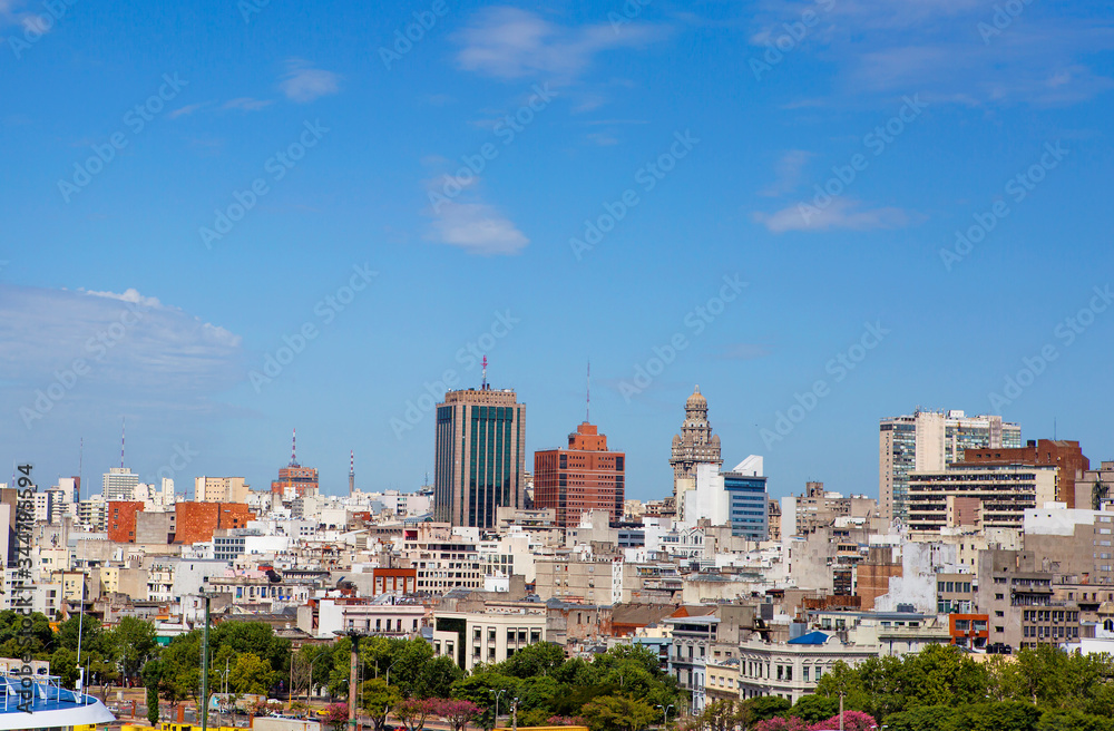 Montevideo, Uruguay, view of the city from the port.
 The port of Montevideo is the main commercial port of Uruguay. In the center of the image, the Palacio Salvo is visible in the distance - the main