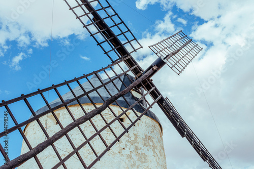 Windmill blades in an aberrant frame of diagonal composition. photo