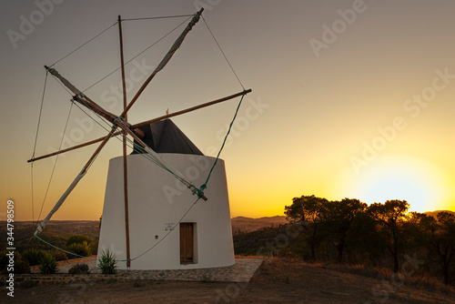 Old windmill at sunset