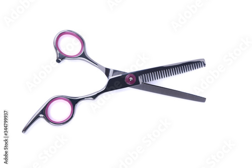 Open scissors with cloves on white background