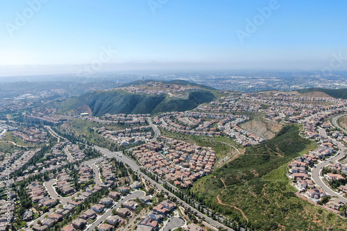 Aerial view of upper middle class neighborhood with big villas around Double Peak Park in San Marcos, California, USA.