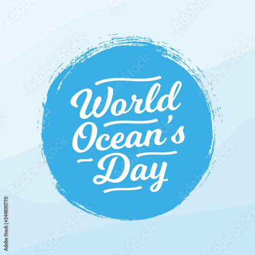 world ocean day lettering in blue brush circle backdrop.
