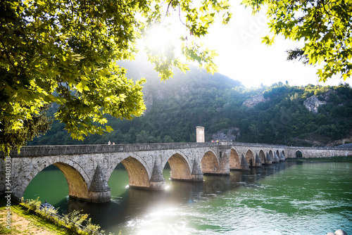 The Ottoman Mehmed Pasa Sokolovic Bridge in Visegrad, Bosnian mountains, with fantastic sky scape and river reflection. Bosnia and Herzegovina.