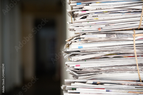 Pile of newspaper, background texture. Lots of retro journals with headlines, articles and photos