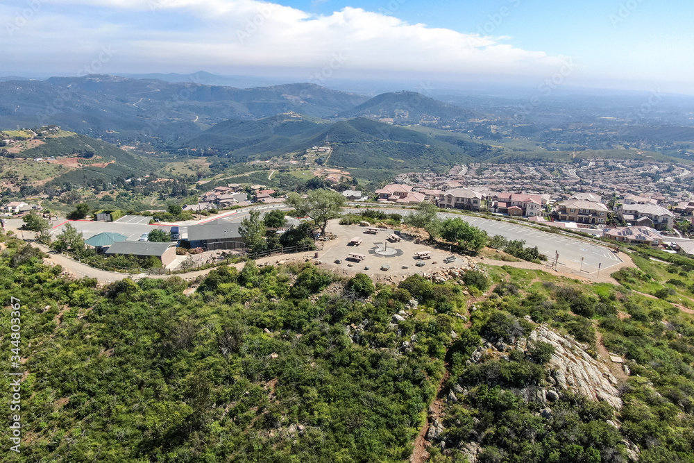 Aerial view of upper middle class neighborhood with big villas around Double Peak Park in San Marcos, California, USA.