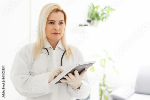 Female Doctor Holding Tablet PC. Doctor's hands close-up. Medical service and health care concept.