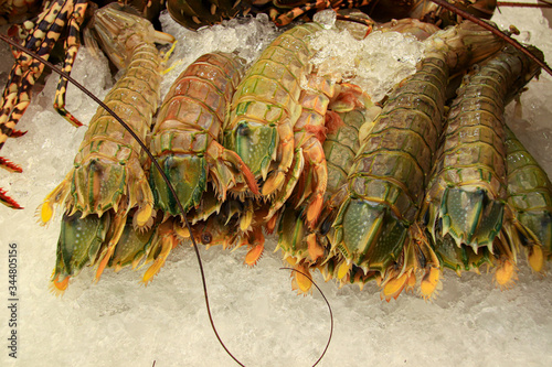 Exotic seafood called Mantis shrimps, or stomatopods sold in the street market of Yaowarat Road or Chinatown in Bangkok City photo