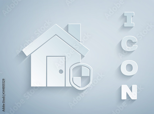 Paper cut House under protection icon isolated on grey background. Home and shield. Protection, safety, security, protect, defense concept. Paper art style. Vector Illustration