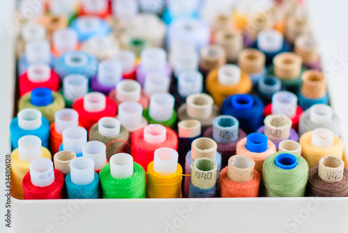 Accessories for sewing. Colored spools of thread
